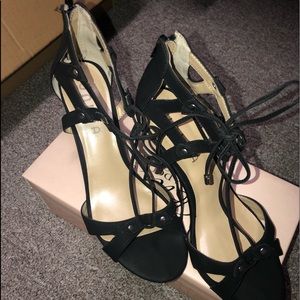 Black strappy heels, front tie & back zip